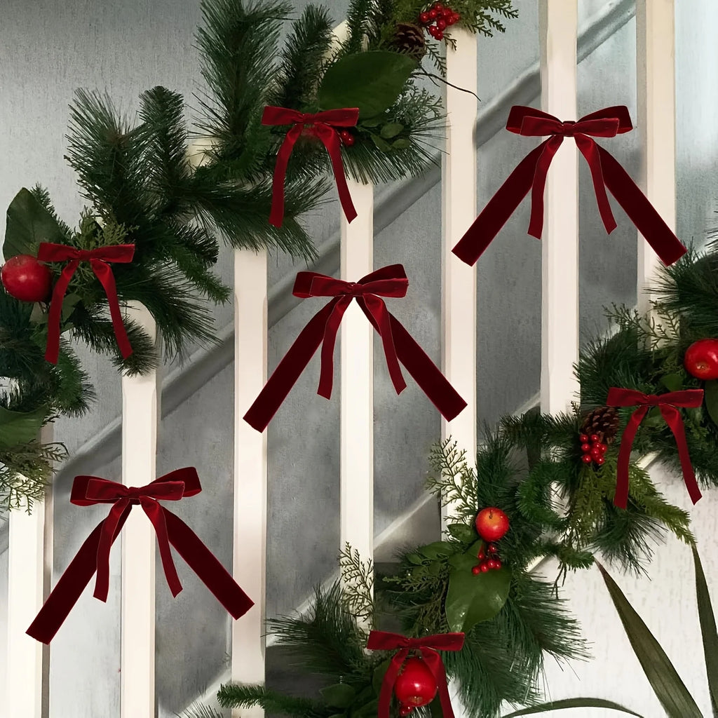 Burgundy bows on a Christmas tree