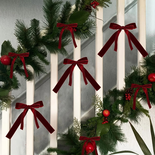 Burgundy bows on a Christmas tree