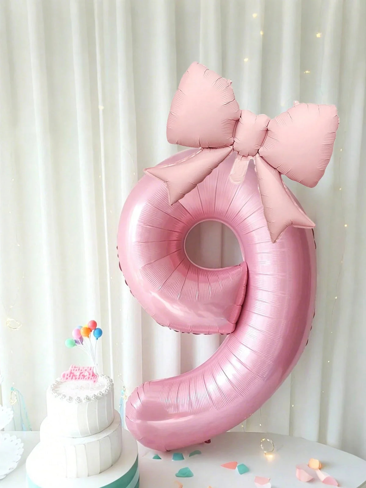 Giant pink number balloon at a birthday