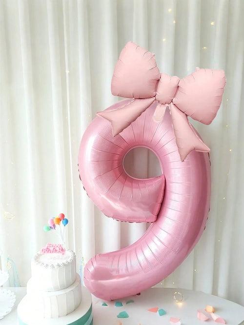 Giant pink number balloon at a birthday
