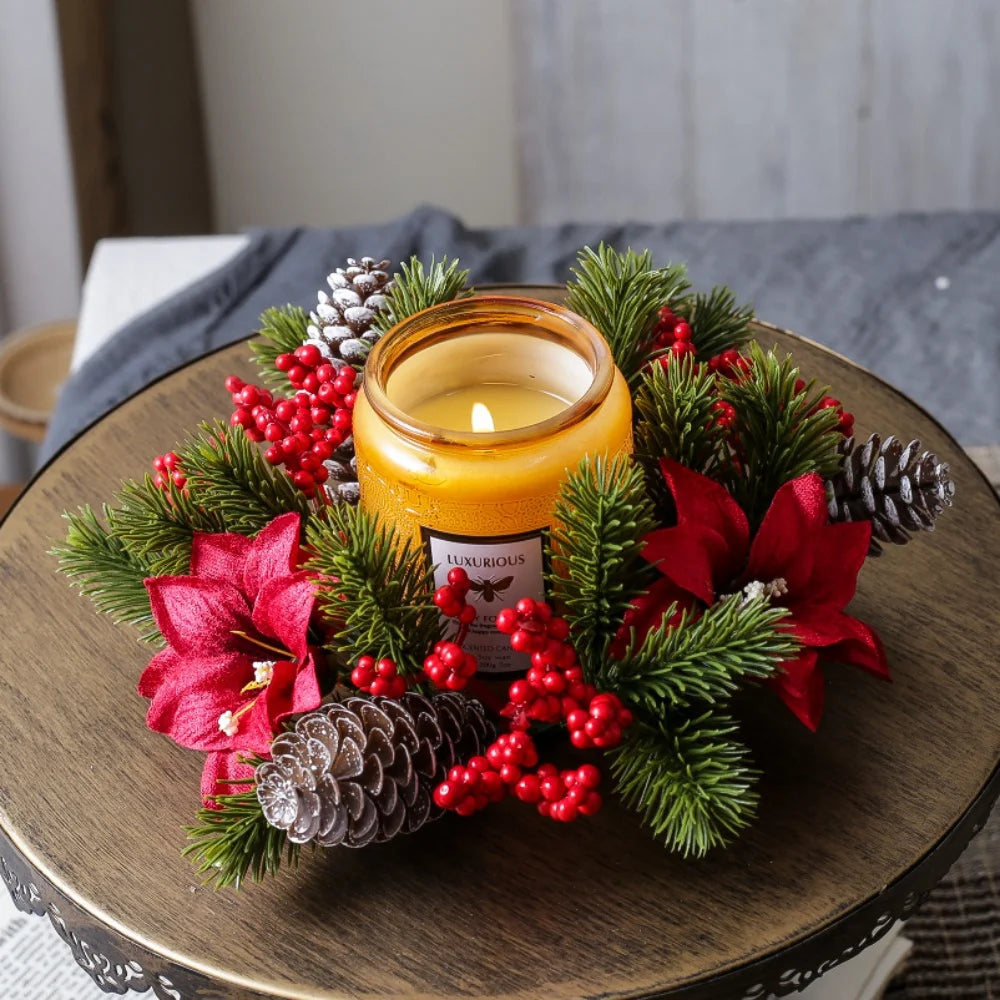 Christmas candle ring wreath with berries and pinecones